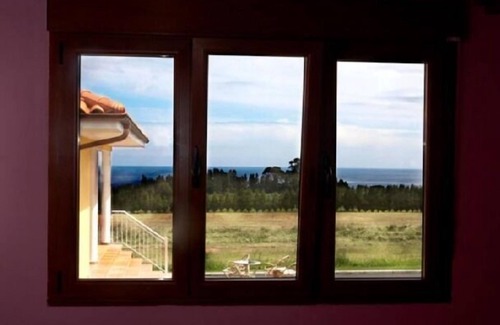 La Atalaya Cottage | Rural apartment El Mirador de Cudillero for 4 people, with private garden.