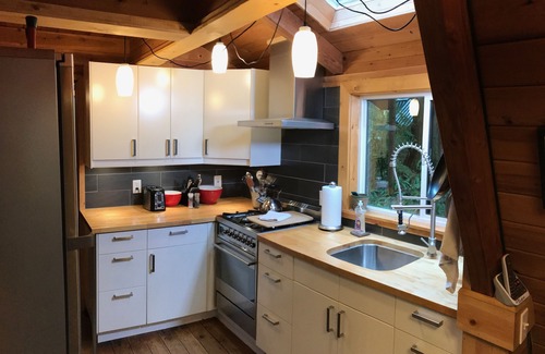 Glacier Cabin | Rustic 70's A-Frame with a cozy modern interior.