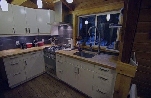 Glacier Cabin | Rustic 70's A-Frame with a cozy modern interior.