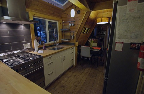 Glacier Cabin | Rustic 70's A-Frame with a cozy modern interior.