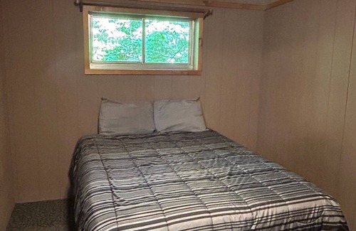 Palmyra Cabin | Rustic cabins in secluded campground with lake access and woods to wander in.
