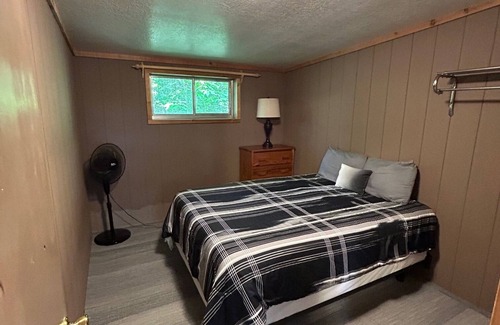 Palmyra Cottage | Rustic cabins in secluded campground with lake access and woods to wander in.