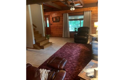 Blossom House | Rustic log cabin in 20 acres of woods.