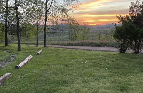 Mountainburg Cabin | Rustic log cabin in the woods with great sunset views