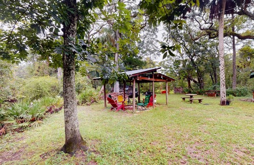 Bronson Cabin | Rustic riverfront cabin with views, firepit, grill, canoe, kitchen, & W/D