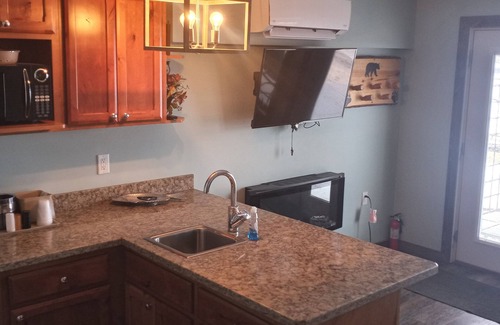 Solon Springs Apartment | Rustic Suite on the Lake: Cozy Comfort with Unmatched Sunrises.