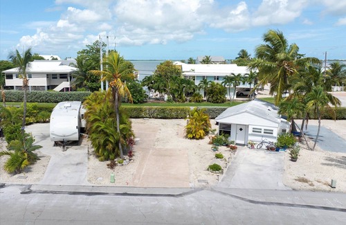 Cudjoe Key RV Rental | RV Lot in Oceanfront Community | Concrete Pad, Lush Landscaping, Walk to Pool & On Site Store