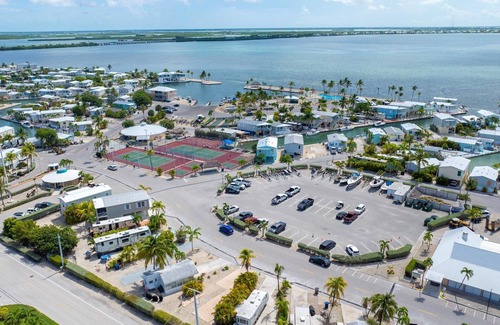 Cudjoe Key RV Rental | RV Lot in Oceanfront Community | Concrete Pad, Lush Landscaping, Walk to Pool & On Site Store