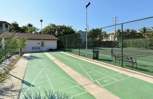 Bradenton Beach Condo | Sandy Feet Retreat Unit 108 at Runaway Bay. 1 min walk to beach.