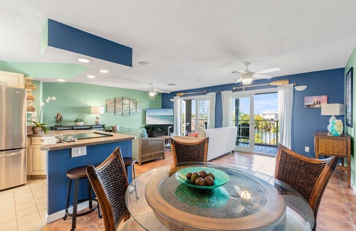 New Town Condo | SEA-NIC VIEW ~ 2 BR/2Ba Water-front views, Heated Pool Access and Dockage!