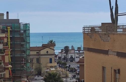 Quartiere XXXIV Lido di Ostia Levante Apartment | Sea view terrace 300 meters from the beach. and for the winter the fireplace.