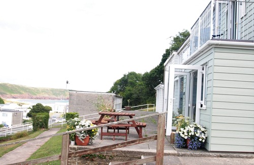 Pembroke Cottage | 'Seahorse' - a Holiday Home with Balcony, Patio and Sea View