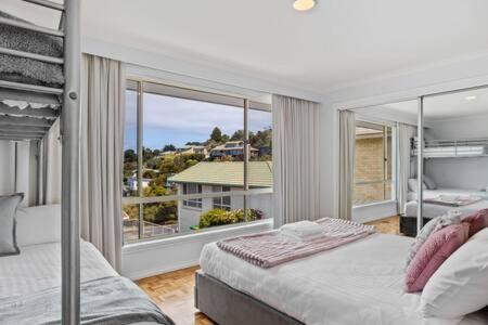 Sandy Bay House | Seaside Serenity: Panoramic Waterfront Retreat
