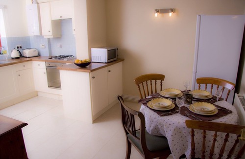 Colwyn Bay House | Seaview from bedroom, lounge and bathroom within an acre garden of tennis court