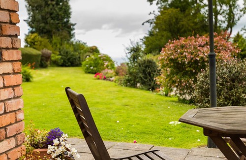 Colwyn Bay House | Seaview from bedroom, lounge and bathroom within an acre garden of tennis court