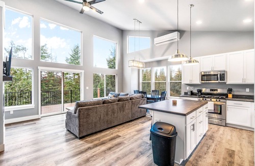 Sandpoint House | Secluded home with deck, grill, hot tub, fireplace, private beach, & W/D