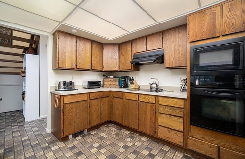Maple City Cottage | Secluded home with three kitchens, vaulted ceilings, washer/dryer, & patios