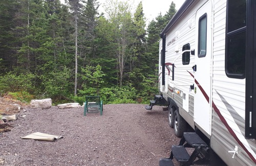 Terra Nova House | Secluded wooded getaway steps from the salt water