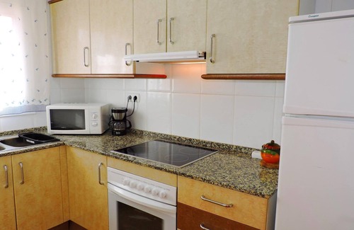Miami Platja Cottage | Semi-detached house with community pool in Miami Playa 400 meters from the sea