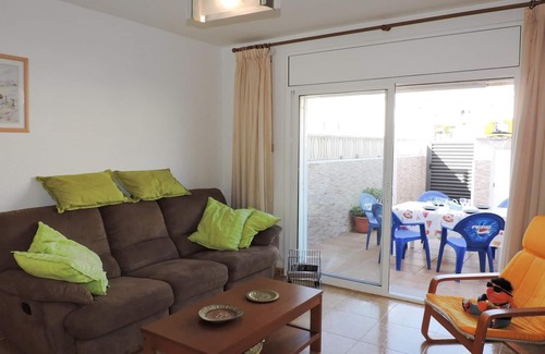 Miami Platja Cottage | Semi-detached house with community pool in Miami Playa 400 meters from the sea