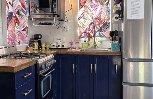 Sweetwater House | “SERENDIPITY” a boho inspired tiny home on wheels in country setting