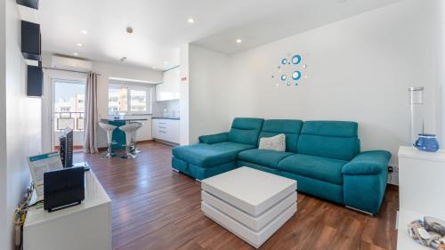 Praia da Rocha Apartment | Serene Blue 1 BDR Flat With Balcony by LovelyStay