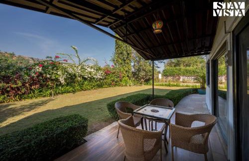 Wadgaon Villa | Serene Garden by VEO - Part of StayVista with Pool and Lawn area