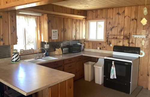 Manistique Cottage | Shoreline Oasis- Make Waves This Summer – Private Beach + Kayaks + Hot Tub