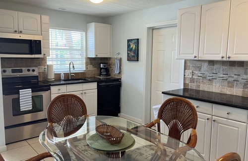 Siesta Key Village House | SHORT WALK TO VILLAGE, BEACH - HEATED POOL - LUSH LANDSCAPINGn2 SEPARATE UNITS.