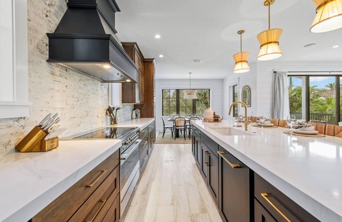 Saint Armands Key House | Showstopping home with a Pool, Rooftop Deck, and Games! Sun-Day Style