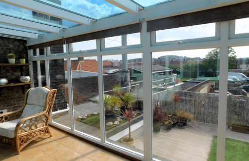 Sheringham Apartment | Sky View - Enjoy panoramic roof top views from the sunny conservatory or outside deck.