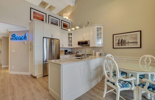 Charlevoix Condo | Soaring Ceilings & Lake Views | Downtown Charlevoix | Pool, Hot Tub, Sauna