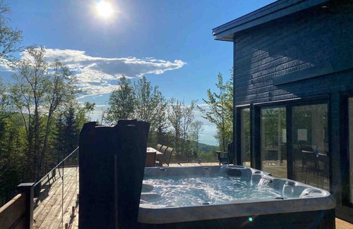 Les Eboulements Ski Chalet | Solar 79: Panoramic Views, Spa, Trails, & Privacy