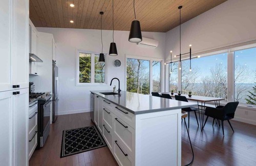 Les Eboulements Ski Chalet | Solstice 203: Luxury Living, Riverfront Serenity