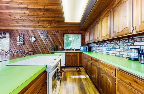 Anderson Island House | Sound view home full of vintage charm with game room, wood stove, & gas grill