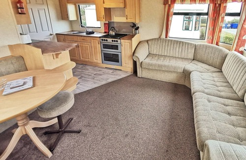 Aberystwyth House | Spacious 12ft-wide caravan with one double and one twin.