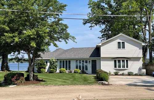Brighton House | Spacious 4BR Lakefront Home with dock, deck, wifi, AC, & large yard in Brighton