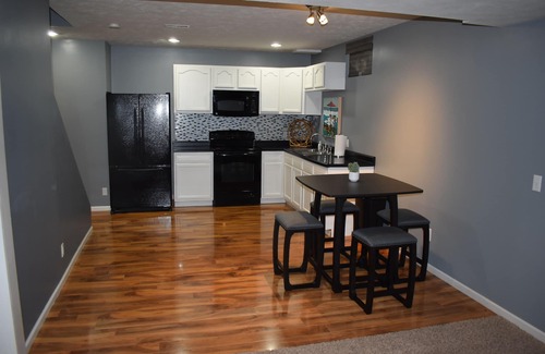 Omaha House | Spacious 5-bed 4-bath retreat. Backyard oasis with pool, hot tub, and fireplace.