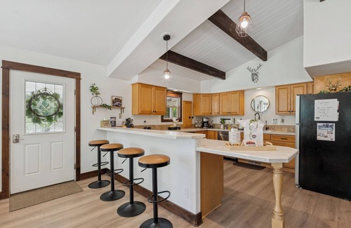 Lakeside House | Spacious 7-Bed Home w/Hot Tub, Fireplace, Gym, Wine Bar, and 2 Living Spaces!