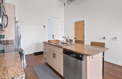 East Market District Condo | Spacious Condo in Center of NULU with Free, Gated, Secure Parking and Entrance