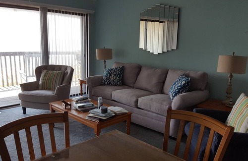 Wilmington Beach Condo | Spacious condo with large deck to view the beautiful ocean just a few feet away.