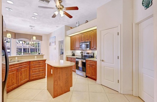 Pelican House | Spacious Gulf Access 4 Bed/4 Bath Pool/Spa Home with Games Room