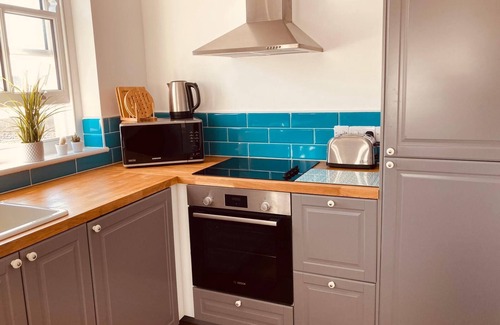 Teignmouth Apartment | Spacious & light apartment ideal for a family or two couples in the town centre.