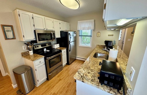 Brewster Condo | Spacious, renovated and beautifully decorated Howland Village townhouse with straight staircase