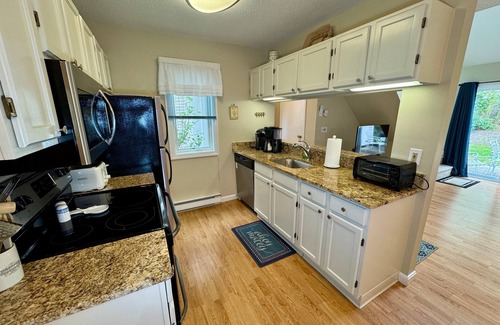 Brewster Condo | Spacious, renovated and beautifully decorated Howland Village townhouse with straight staircase