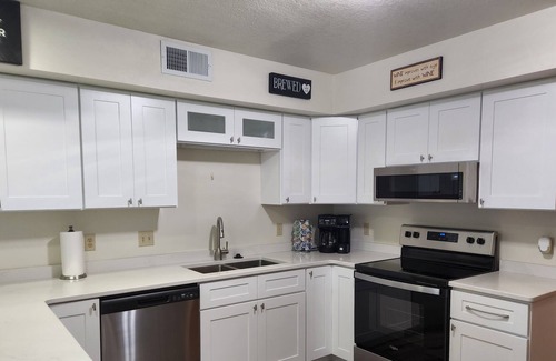 Tomah House | Spacious Townhome in quiet neighborhood with firepit!