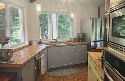 Haliburton House | Spacious, waterfront home surrounded by trees with large dock & games room.