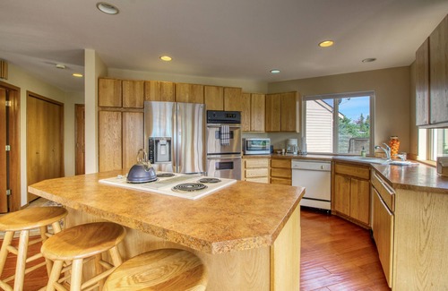 Helios Hills House | Spacious & Welcoming Home with Lake View, Private Hot Tub, & Wraparound Deck