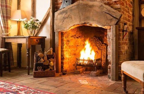 Long Melford House | Spadgers, a flax workers cottage next to fields in a Medieval Village