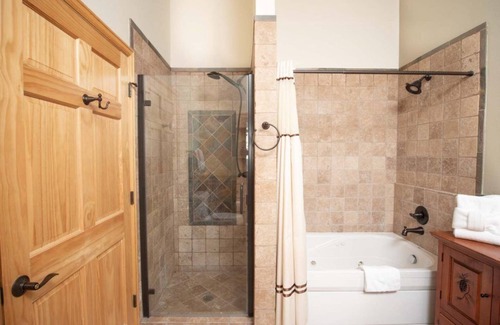 Stanley Hills Condo | Spectacular views of Lake Estes, private patio, hot tub, fireplace.